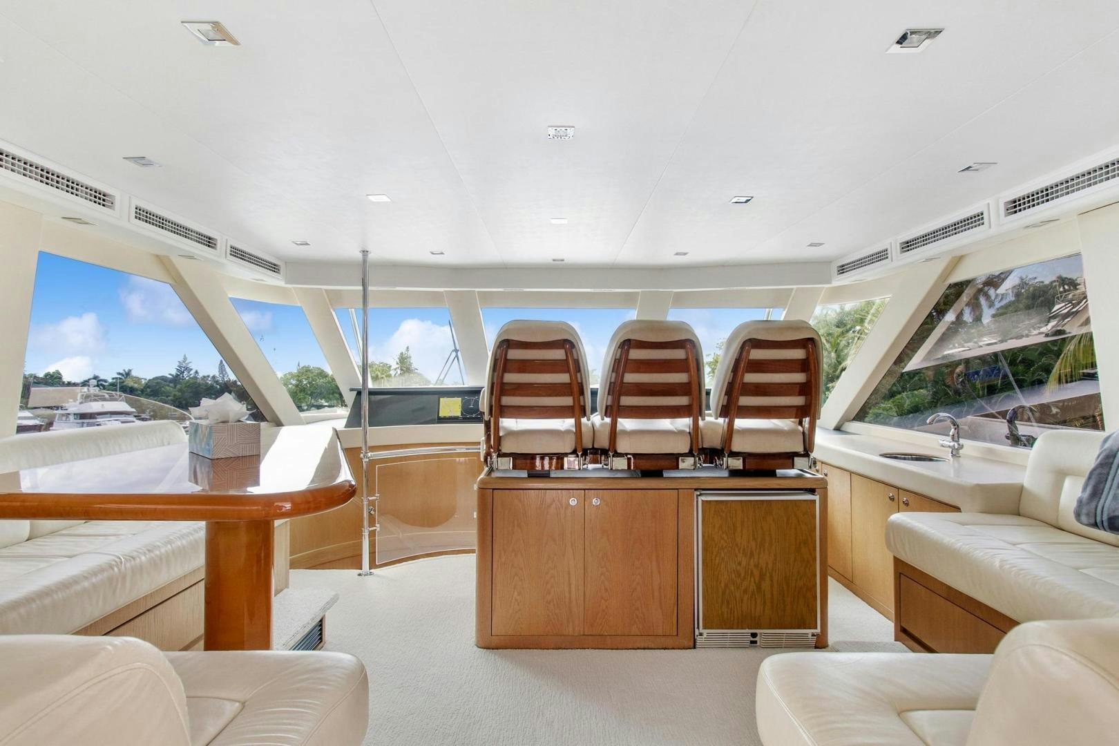 a room with a table chairs and a large window aboard BELLISSIMA Yacht for Sale