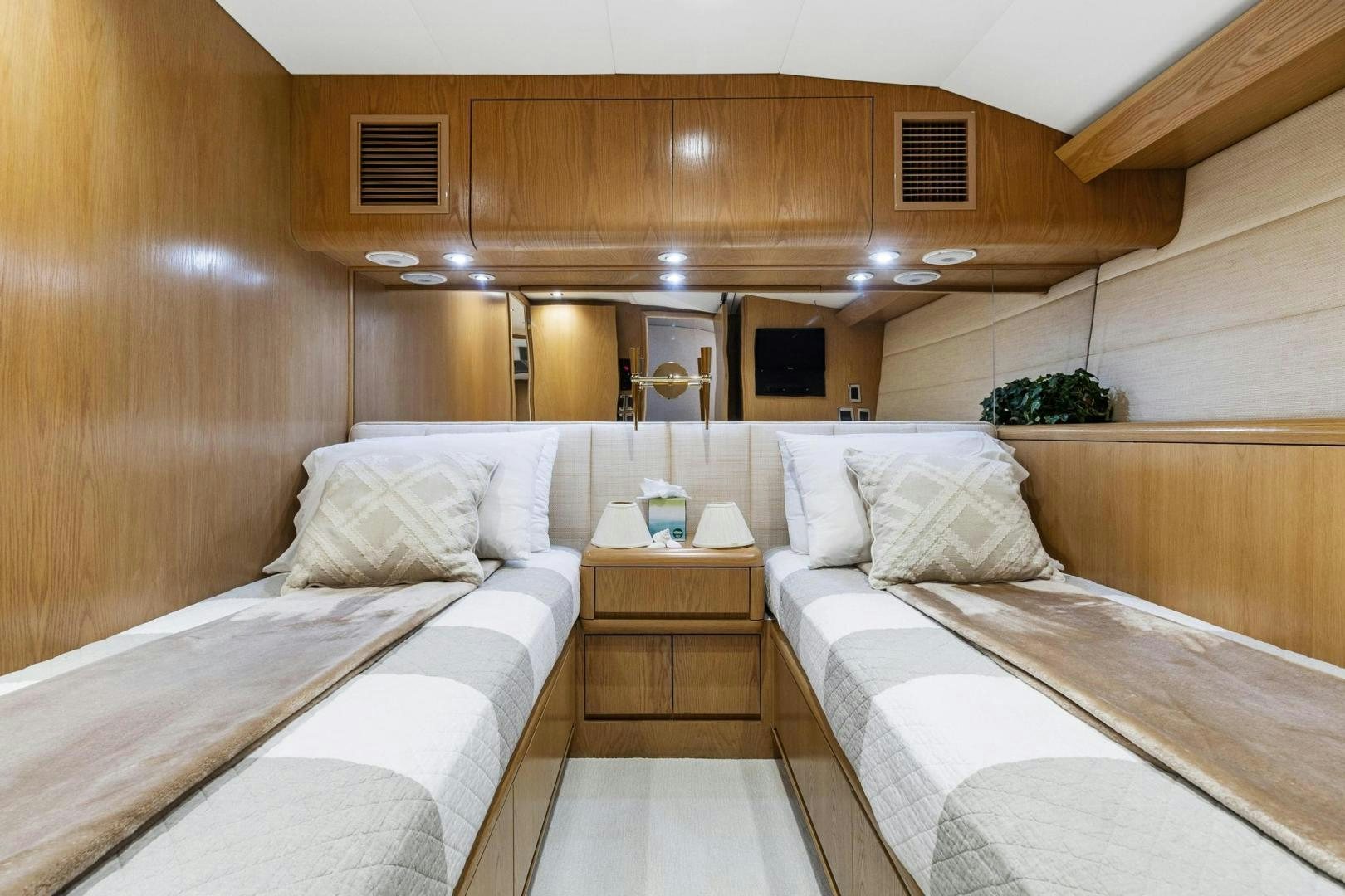 a room with a bed and a wood wall aboard BELLISSIMA Yacht for Sale