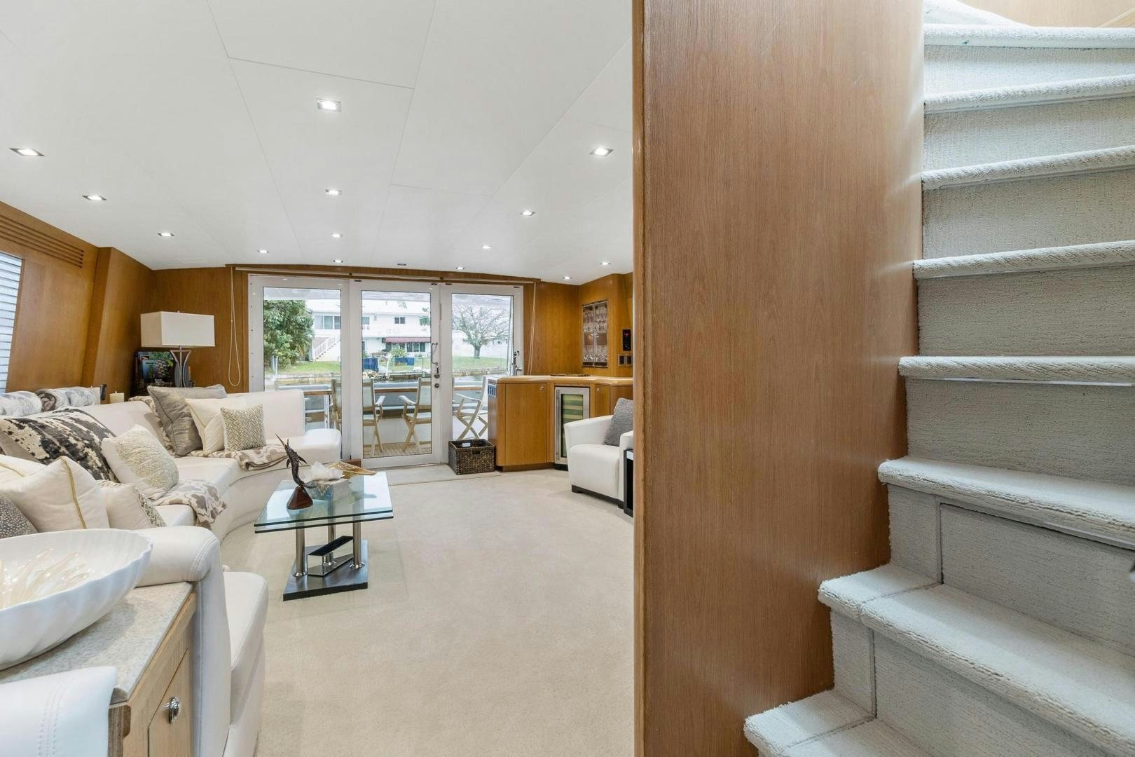 a living room with a staircase aboard BELLISSIMA Yacht for Sale