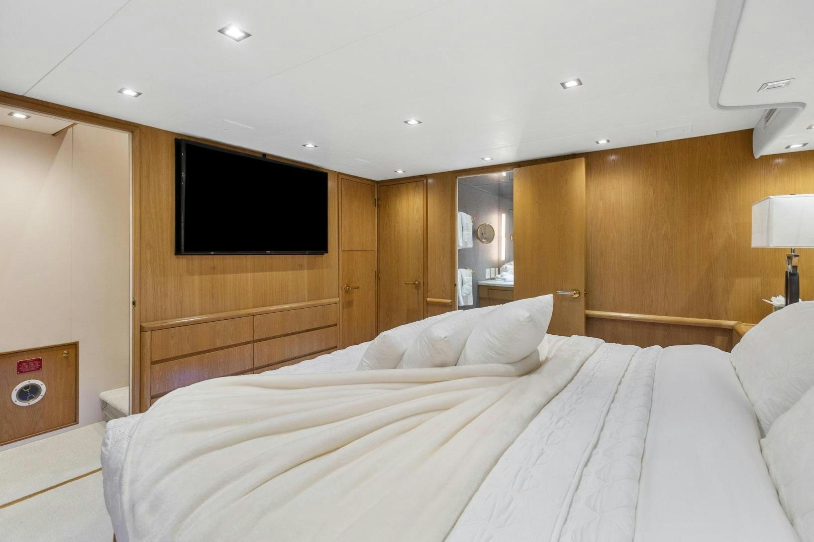 a bed with white sheets aboard BELLISSIMA Yacht for Sale