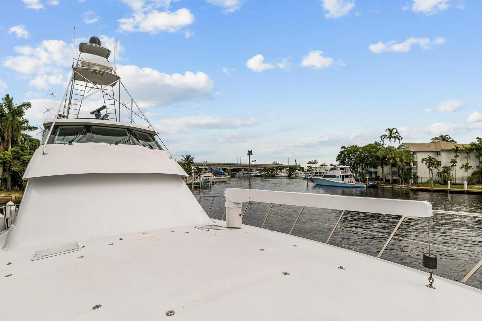 a white boat on a dock aboard BELLISSIMA Yacht for Sale