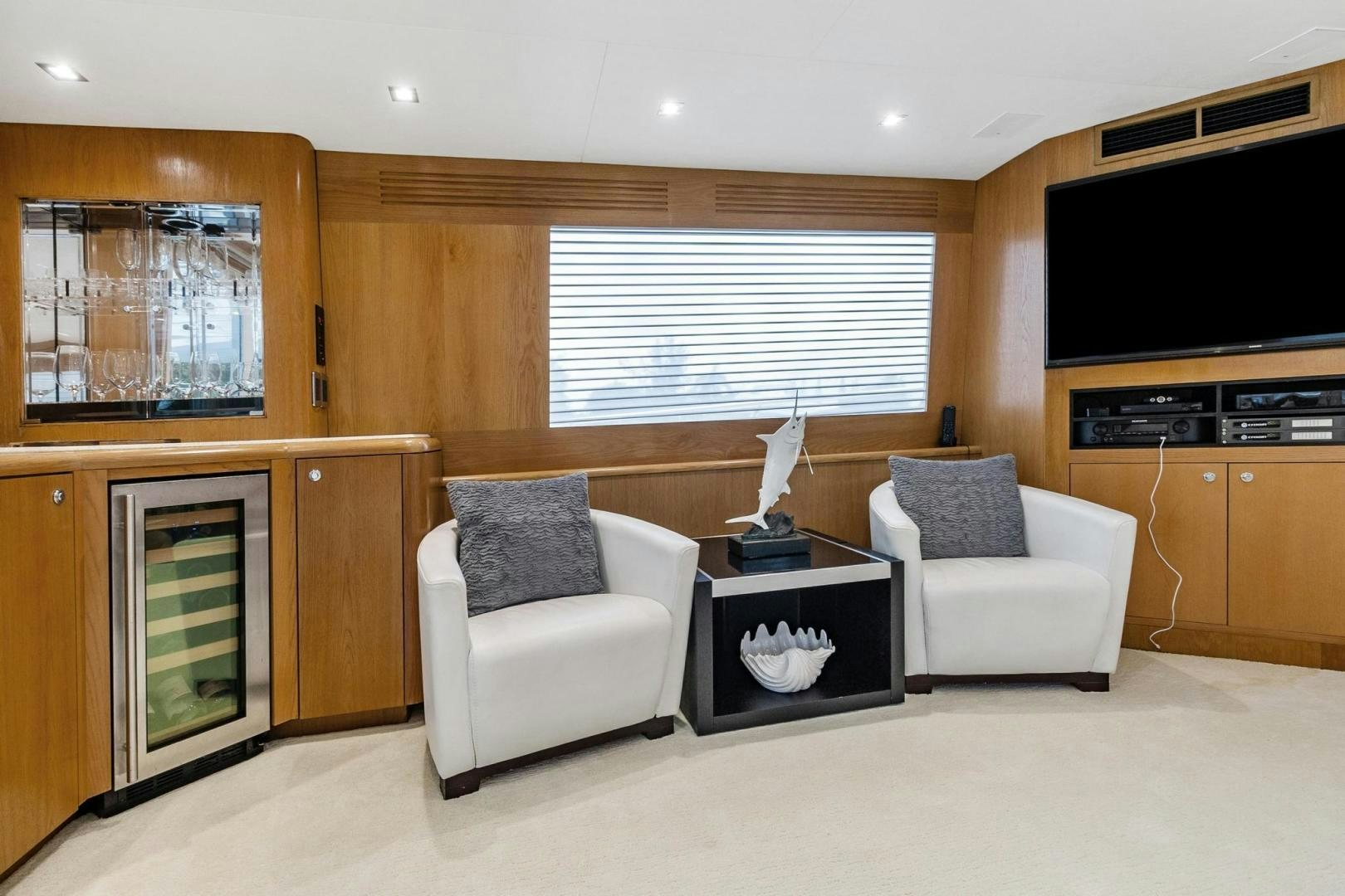 a living room with a fireplace aboard BELLISSIMA Yacht for Sale