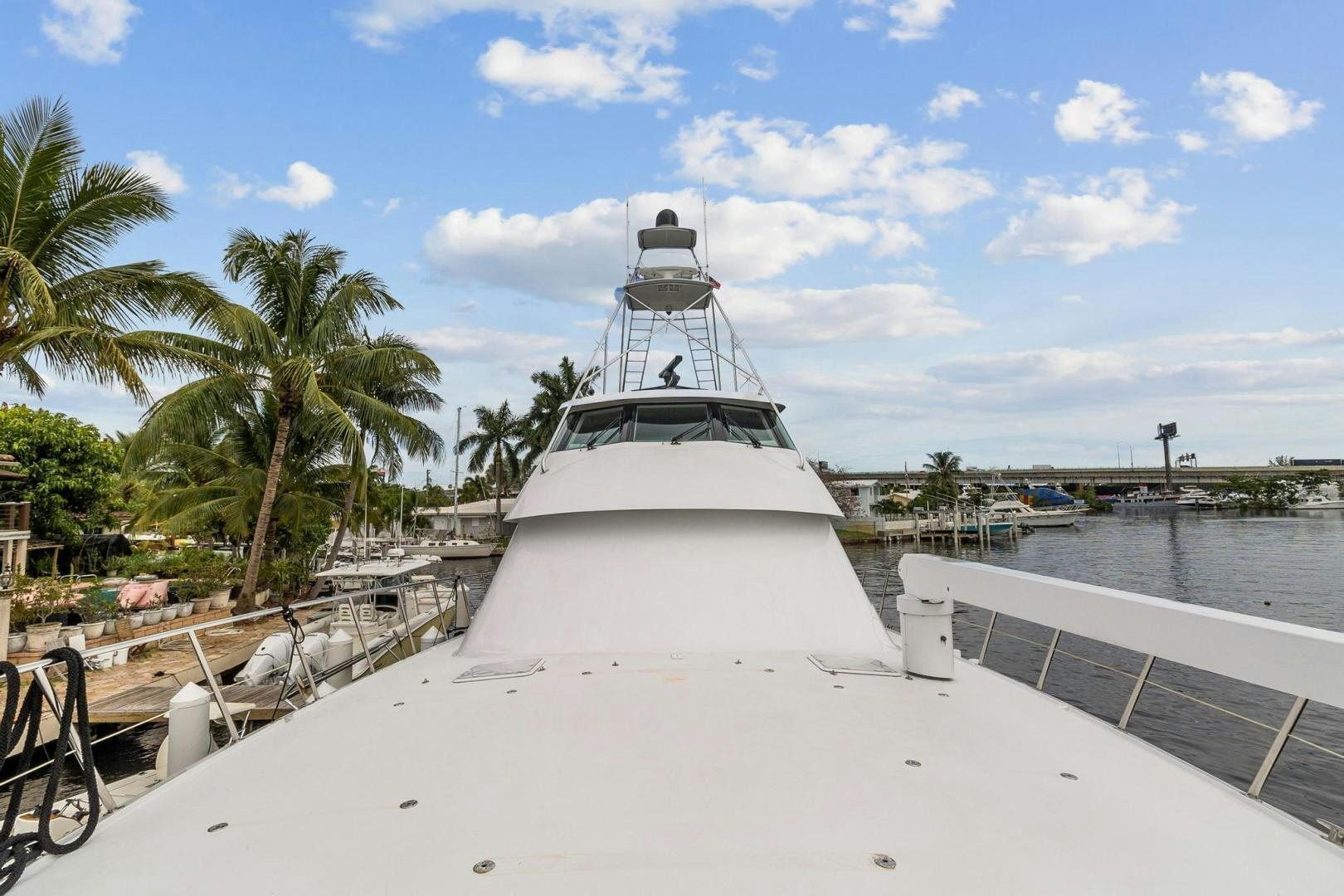 a white boat on a dock aboard BELLISSIMA Yacht for Sale