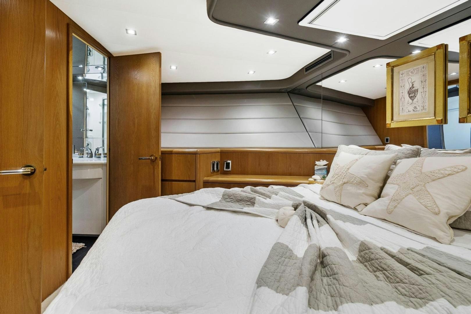 a bed with white sheets aboard BELLISSIMA Yacht for Sale