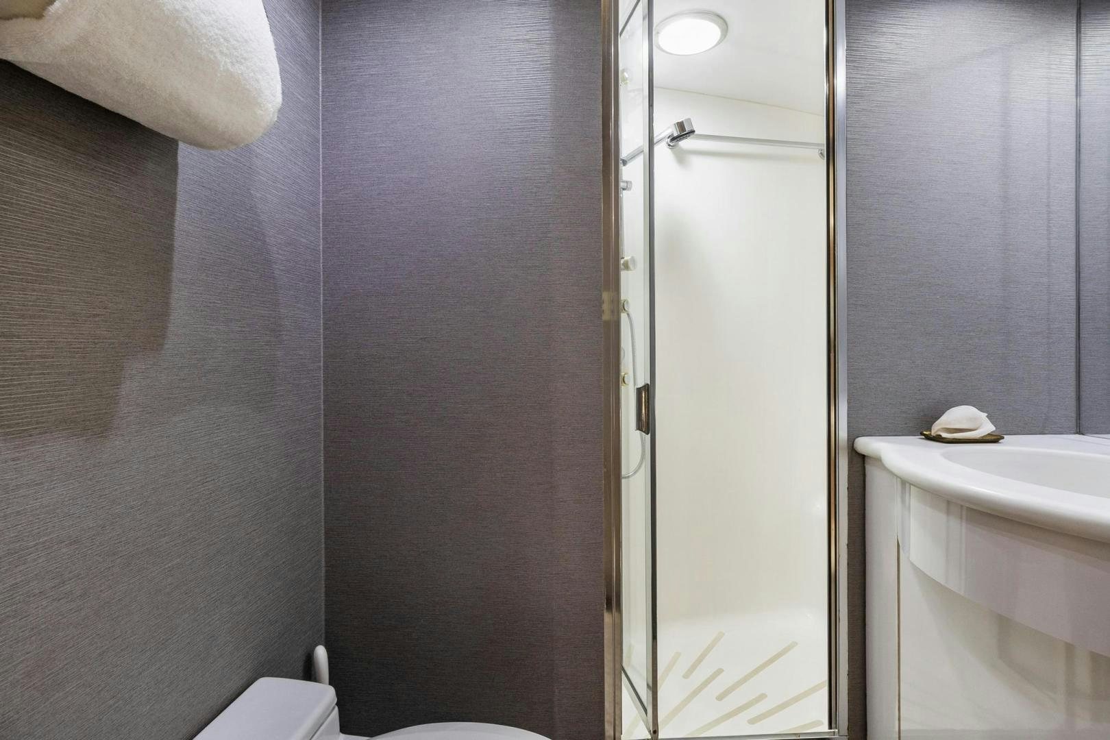 a bathroom with a shower and sink aboard BELLISSIMA Yacht for Sale