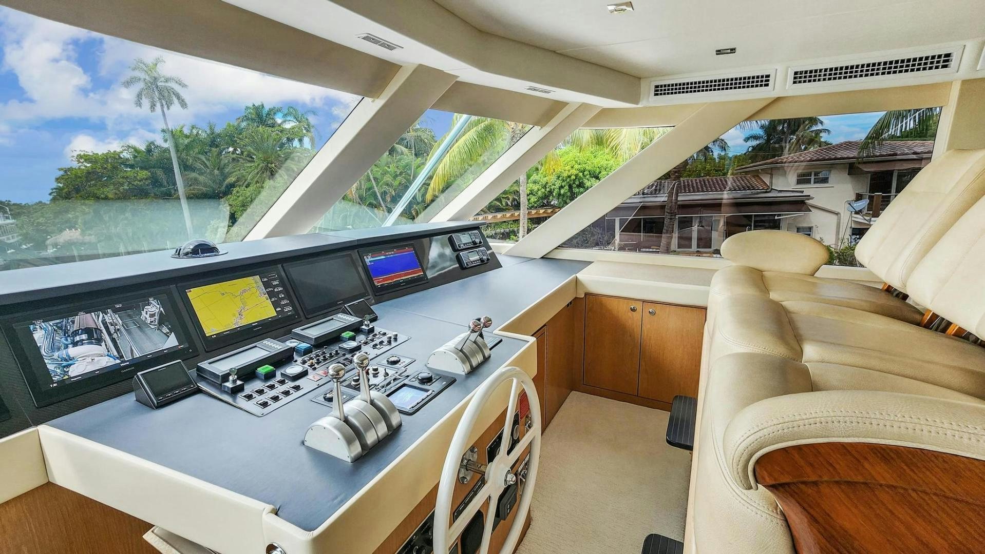 a room with a large window and a desk with computers on it aboard BELLISSIMA Yacht for Sale