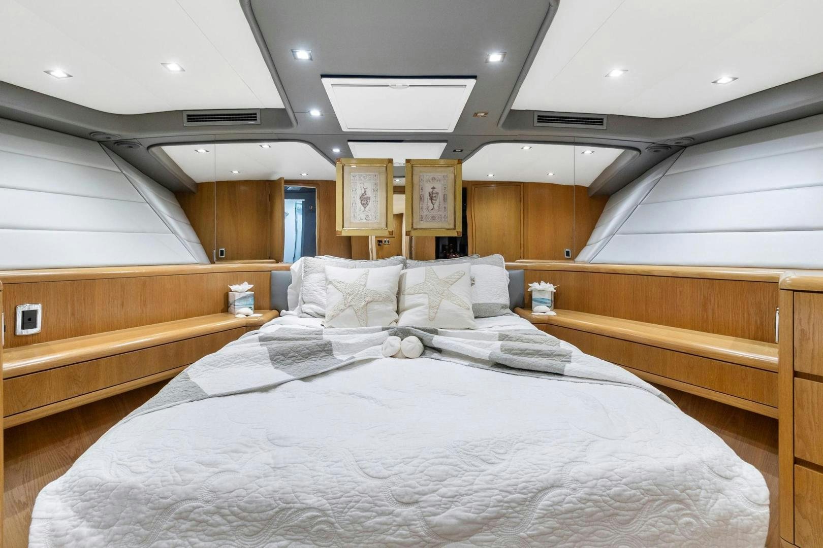a room with a bed and a window aboard BELLISSIMA Yacht for Sale