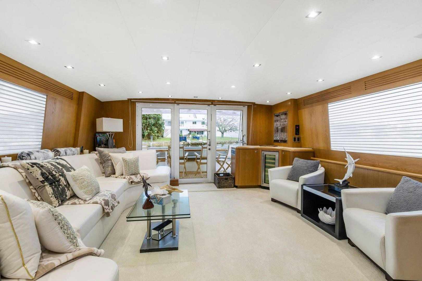 a living room with a glass coffee table and a couch aboard BELLISSIMA Yacht for Sale