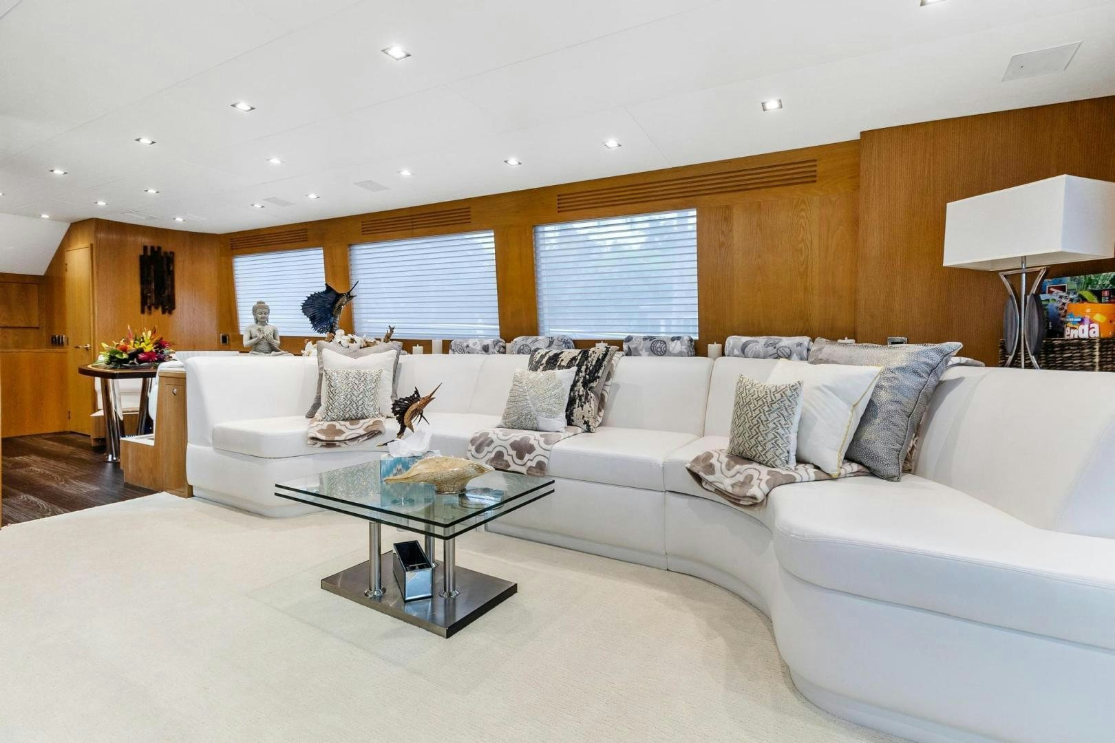 a living room with a white couch aboard BELLISSIMA Yacht for Sale