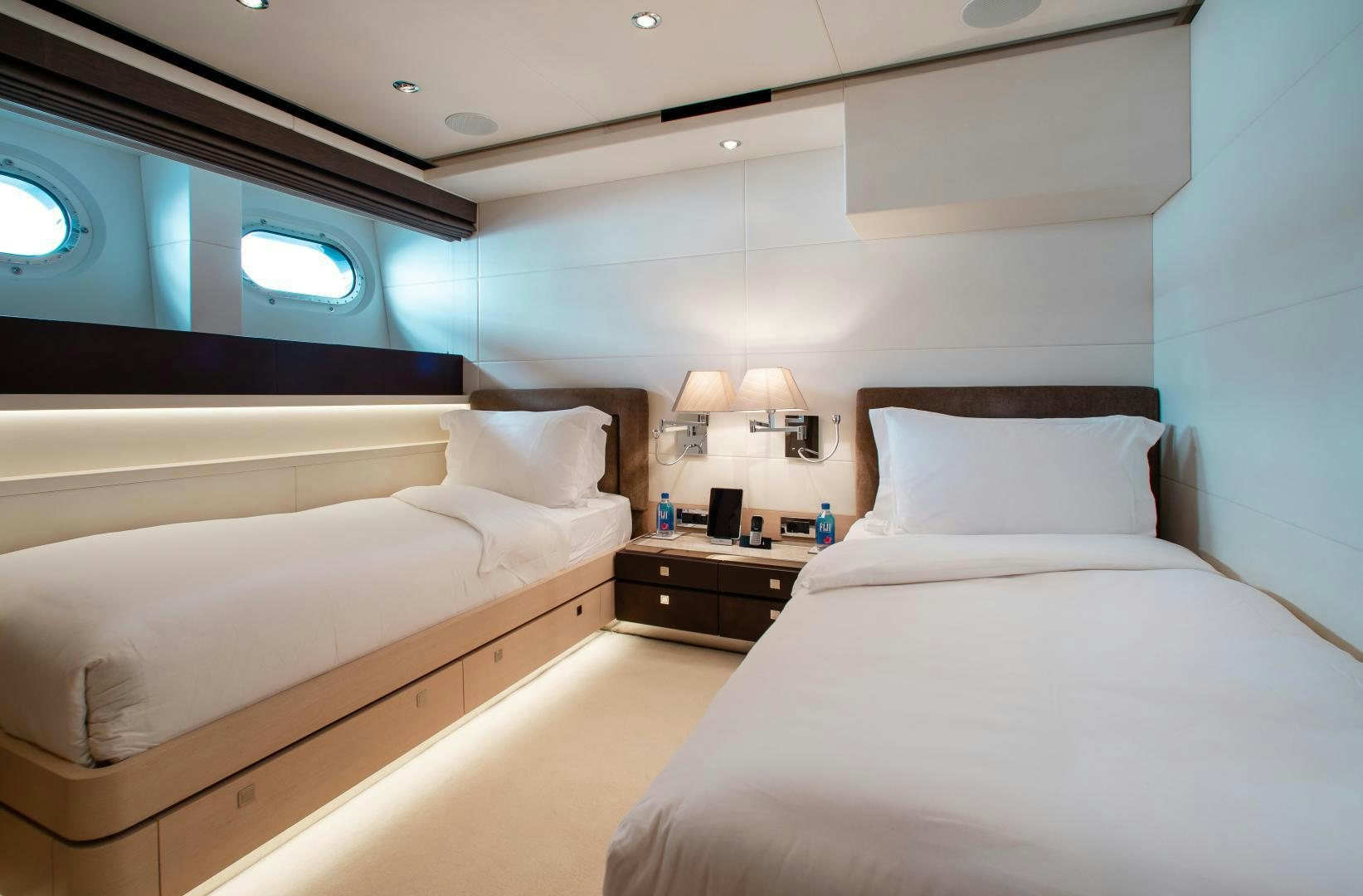 a room with two beds aboard LADY L Yacht for Charter