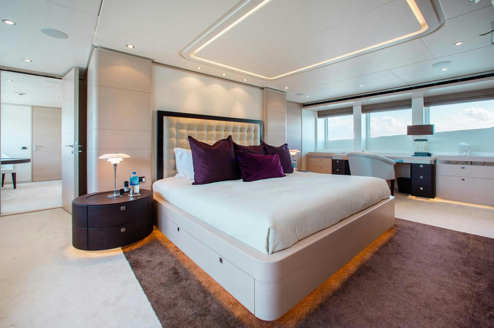 a large bedroom with a large bed aboard LADY L Yacht for Sale