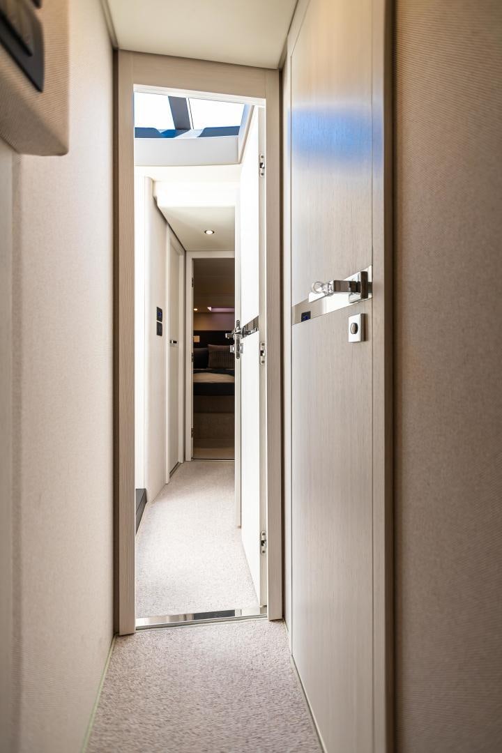 a hallway with doors aboard BLESSED Yacht for Sale
