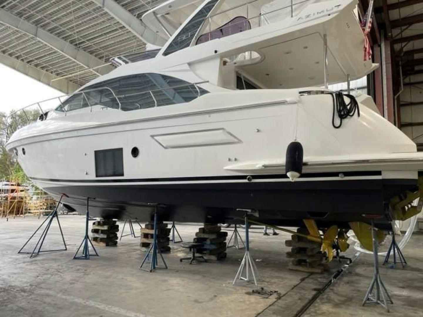 a white airplane in a hangar aboard BLESSED Yacht for Sale