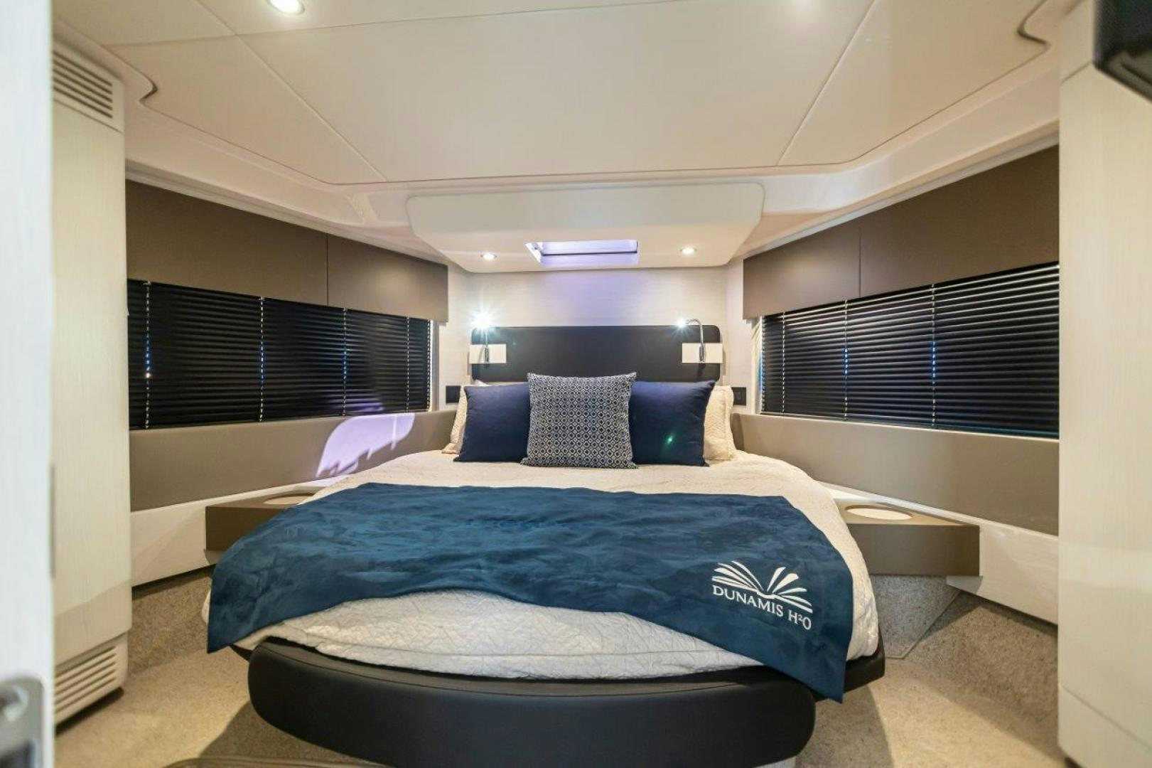 a room with a bed and a window aboard BLESSED Yacht for Sale
