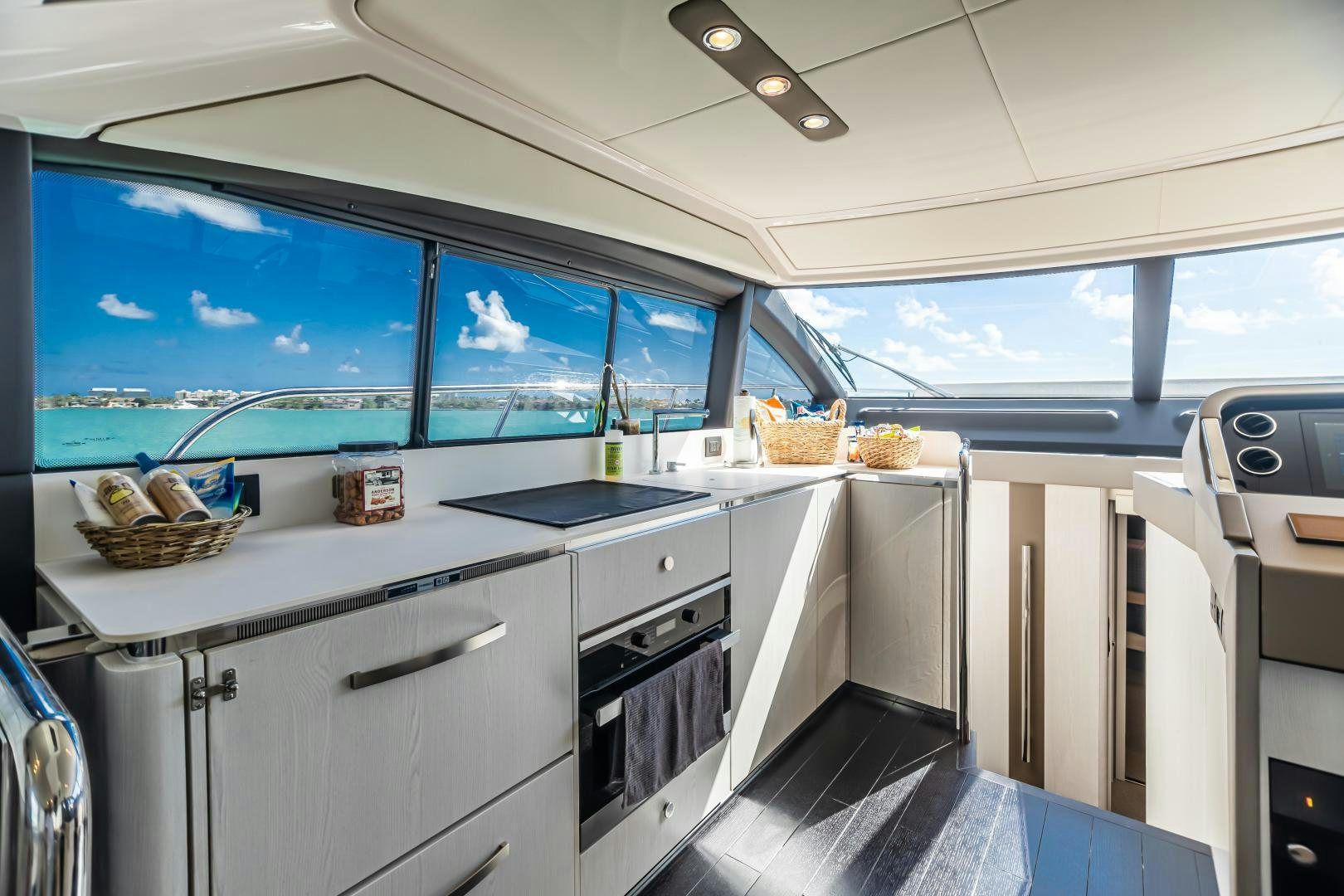 a kitchen with a large window aboard BLESSED Yacht for Sale