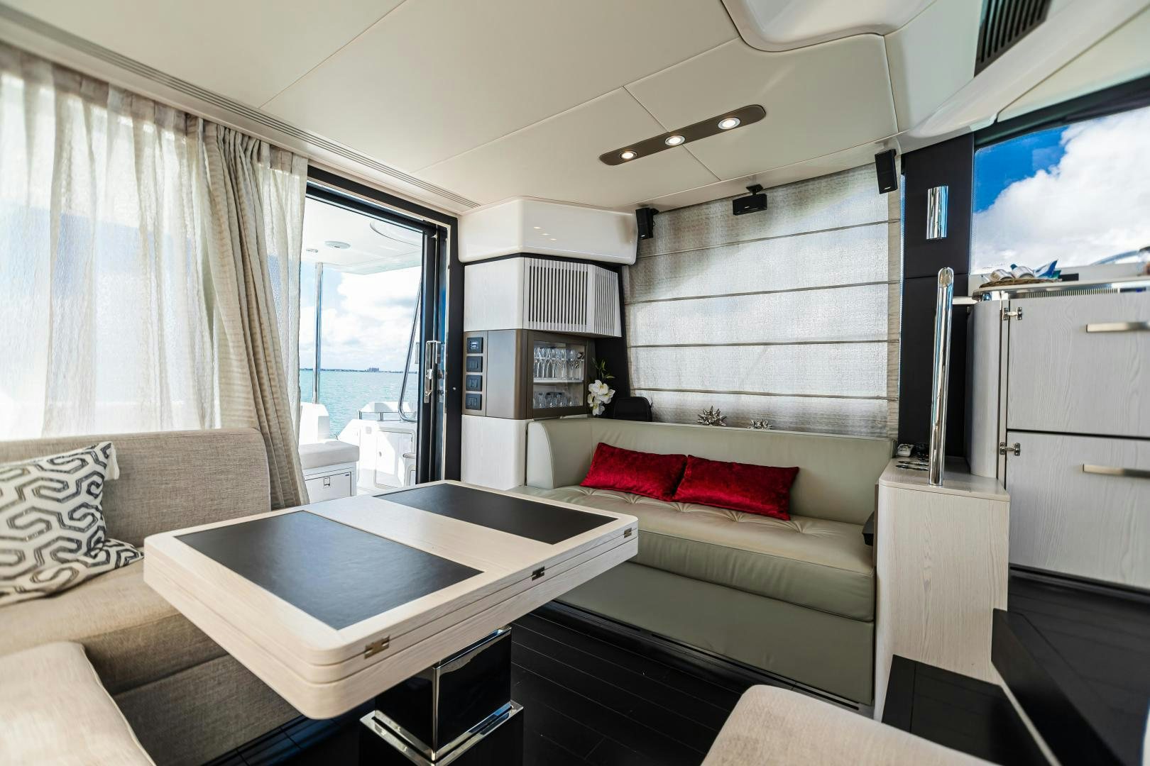 a living room with a couch and a table aboard BLESSED Yacht for Sale