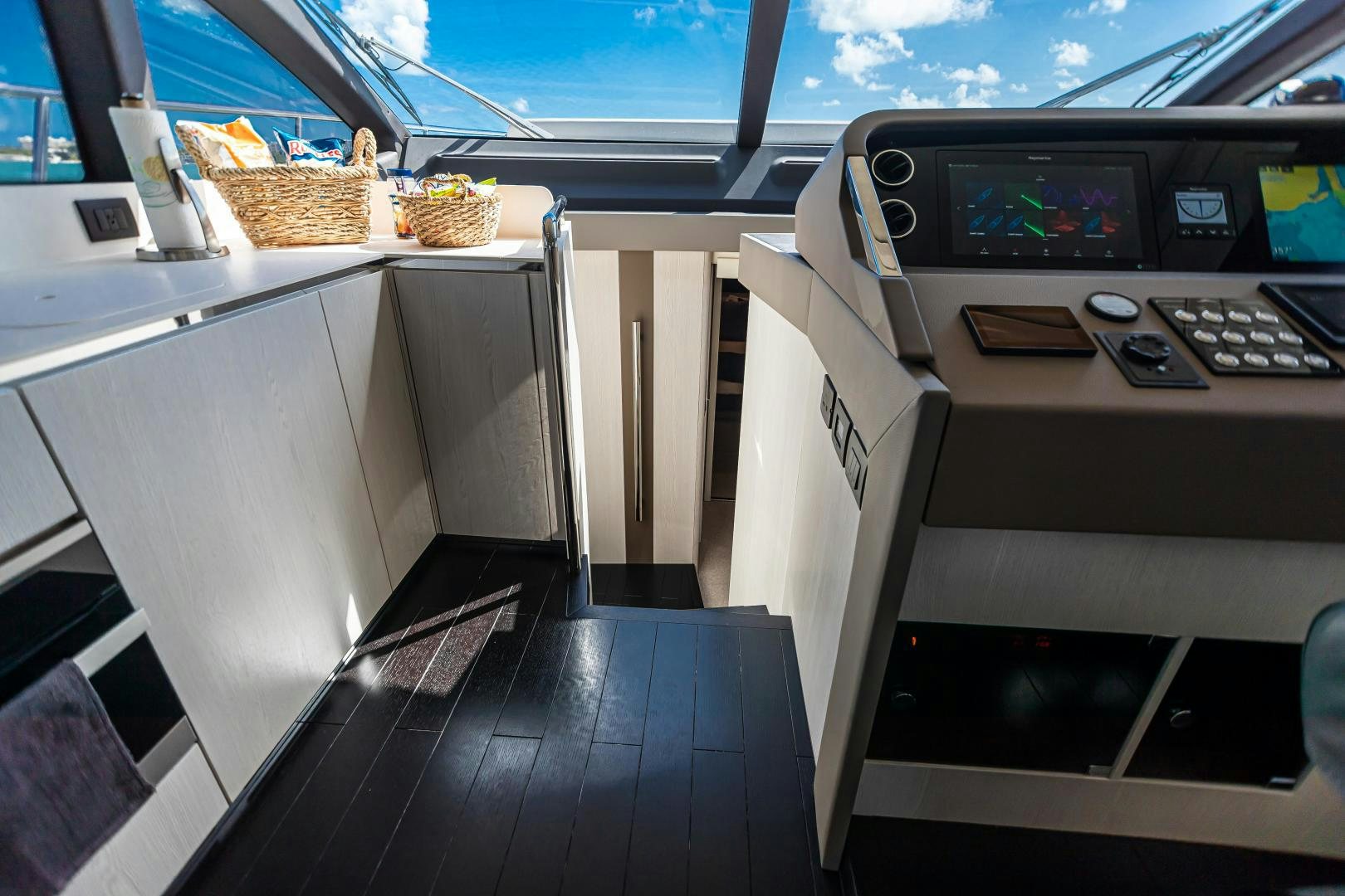 a boat with a desk and computer aboard BLESSED Yacht for Sale