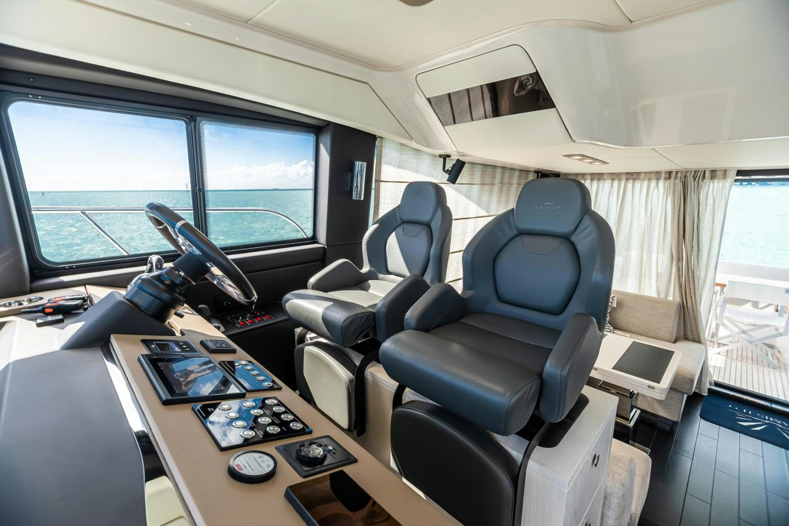 a plane with a desk and a laptop on it aboard BLESSED Yacht for Sale