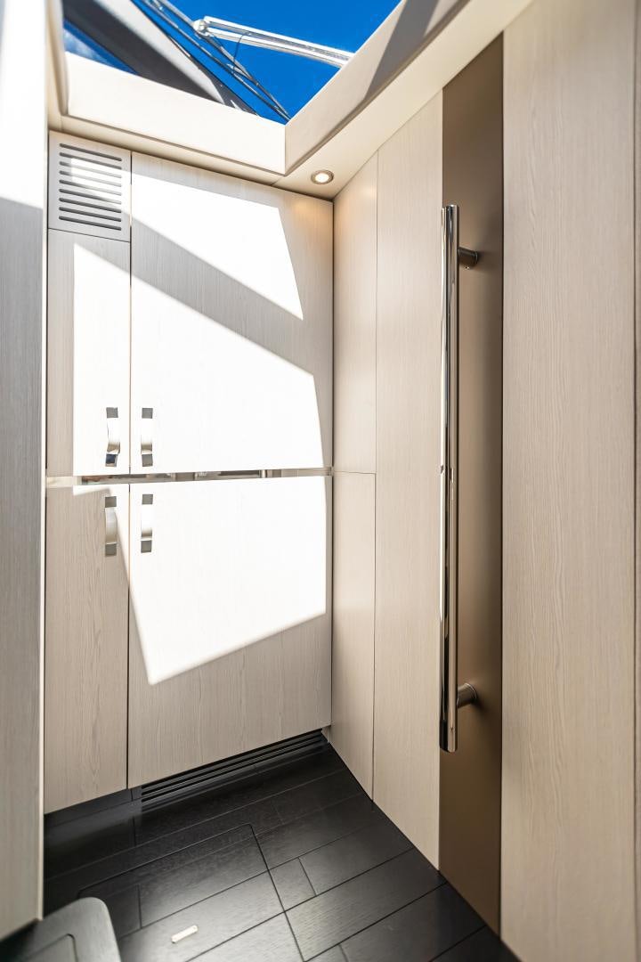 a room with a door and a window aboard BLESSED Yacht for Sale