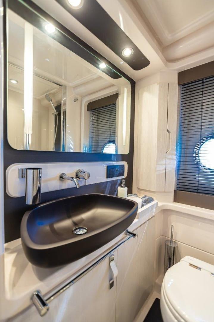 a bathroom with a sink and a mirror aboard BLESSED Yacht for Sale