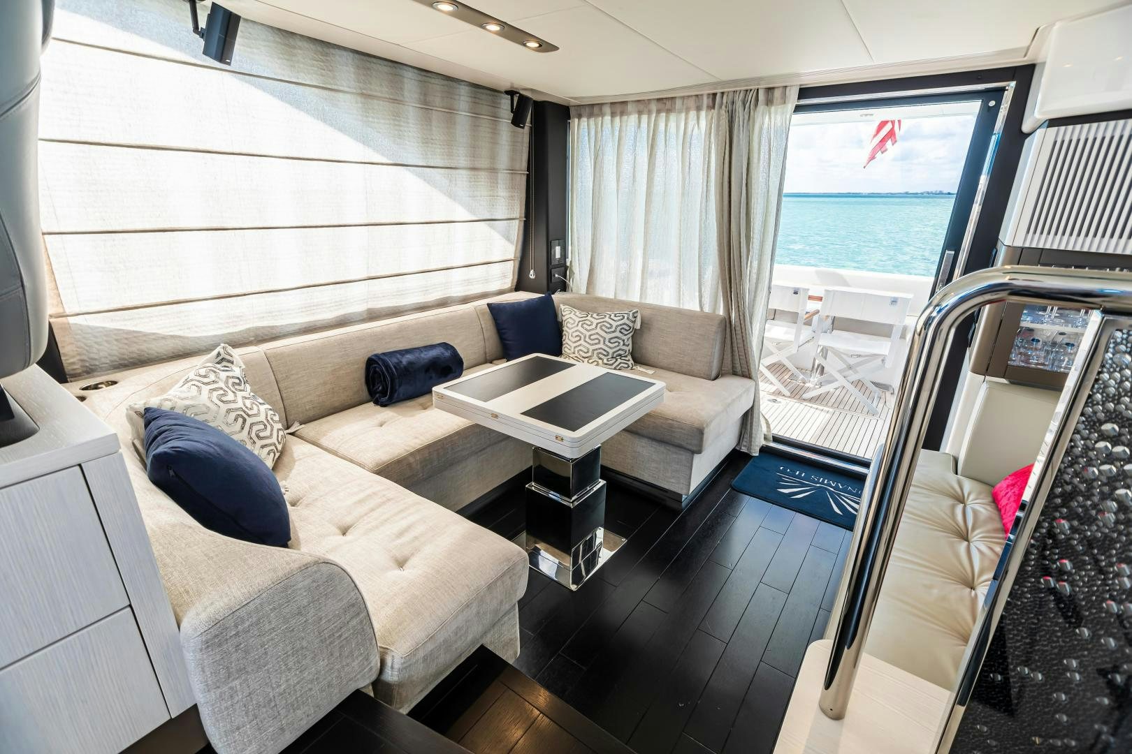 a living room with a couch and a table aboard BLESSED Yacht for Sale
