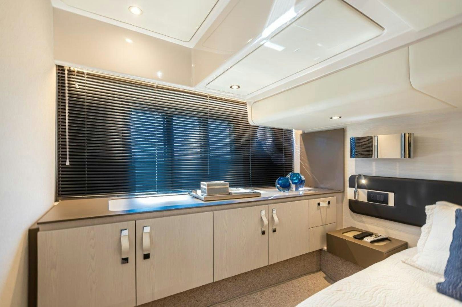 a room with a bed and a desk aboard BLESSED Yacht for Sale