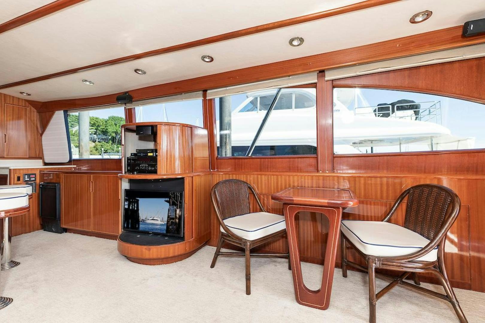 a room with a table and chairs aboard ADVENTURER Yacht for Sale