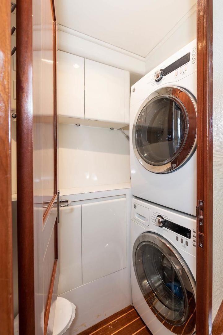 a washer and dryer in a room aboard ADVENTURER Yacht for Sale