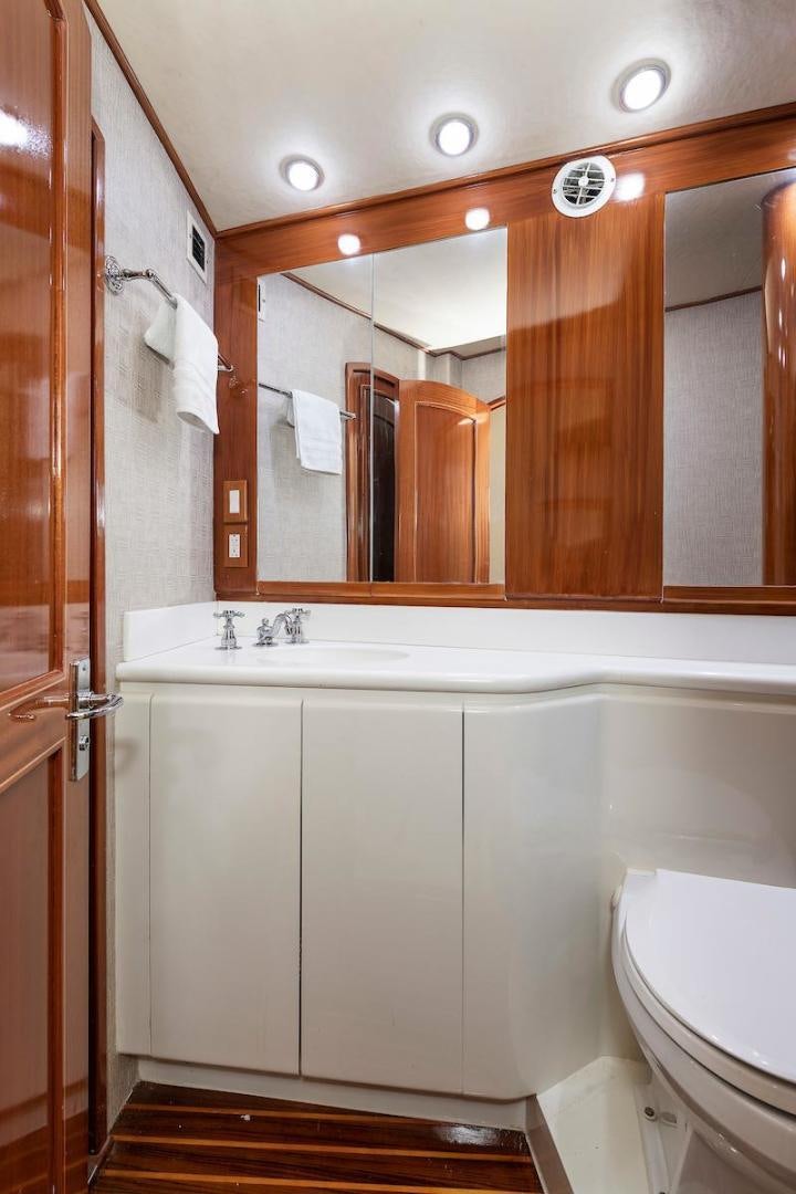 a bathroom with a large mirror aboard ADVENTURER Yacht for Sale