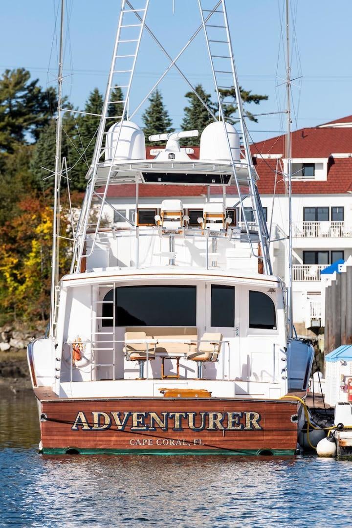 a boat docked in a harbor aboard ADVENTURER Yacht for Sale