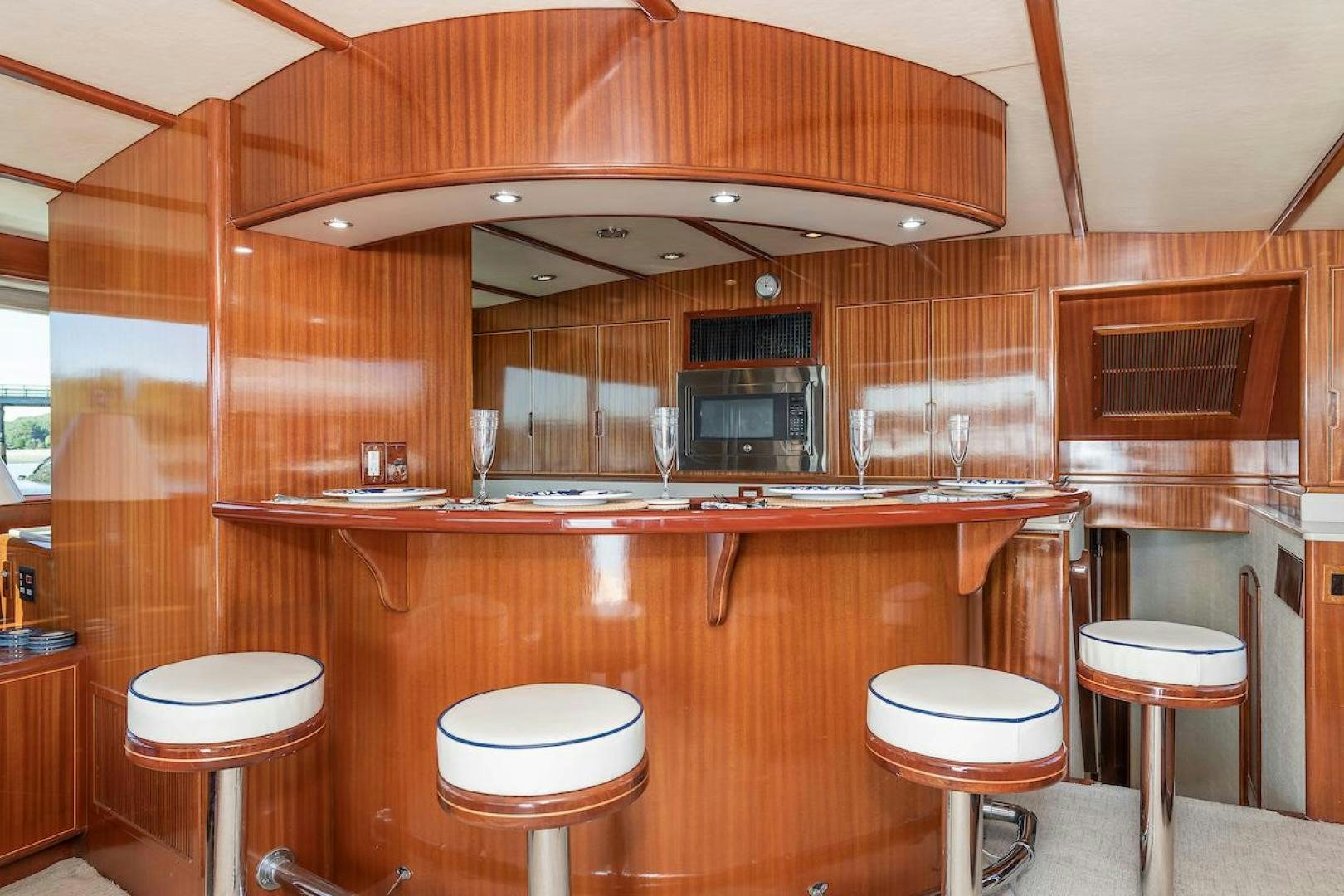 a kitchen with wooden cabinets aboard ADVENTURER Yacht for Sale