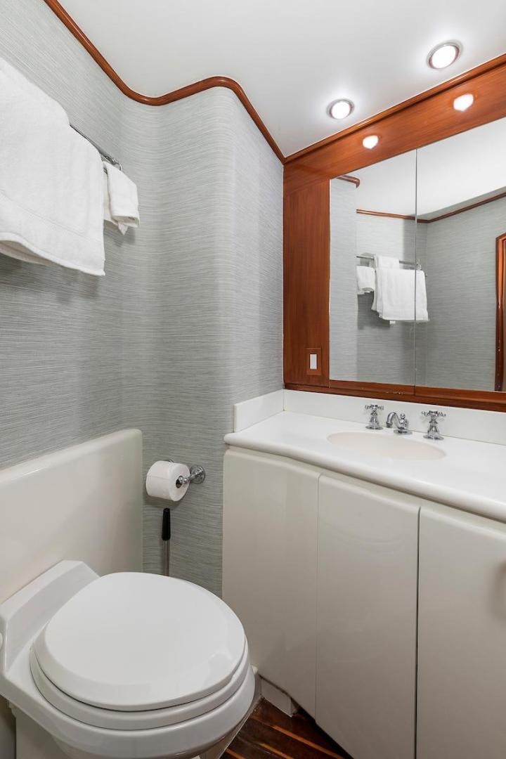 a bathroom with a toilet and a sink aboard ADVENTURER Yacht for Sale