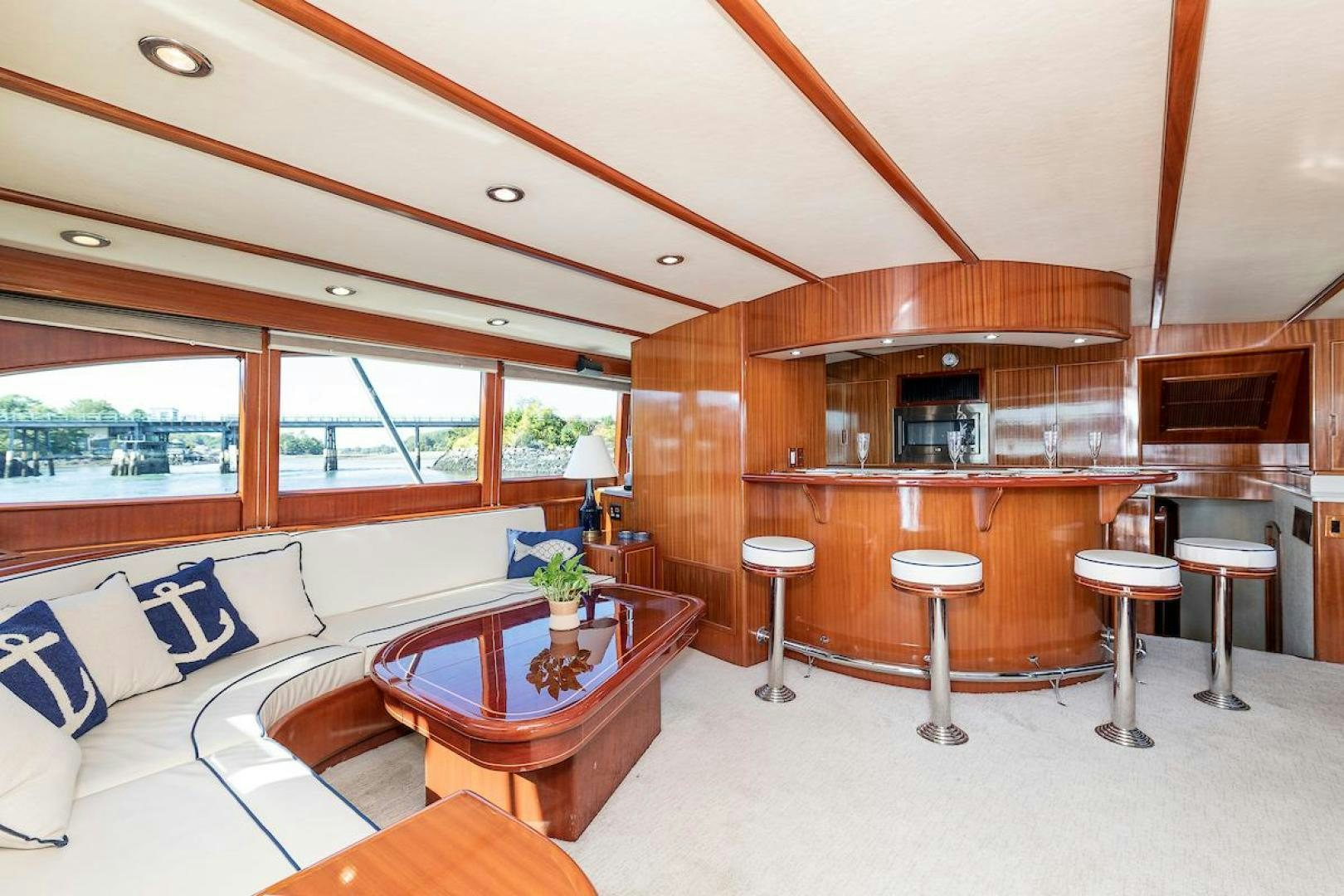 a room with a couch and a table and chairs aboard ADVENTURER Yacht for Sale
