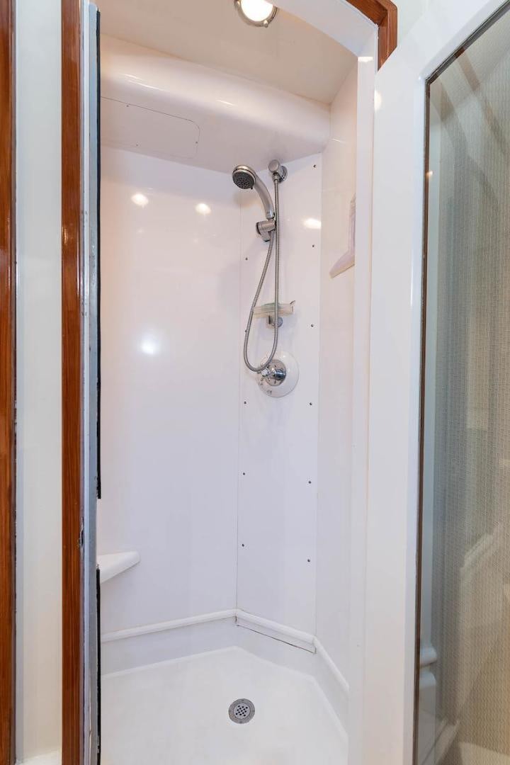 a shower with a glass door aboard ADVENTURER Yacht for Sale
