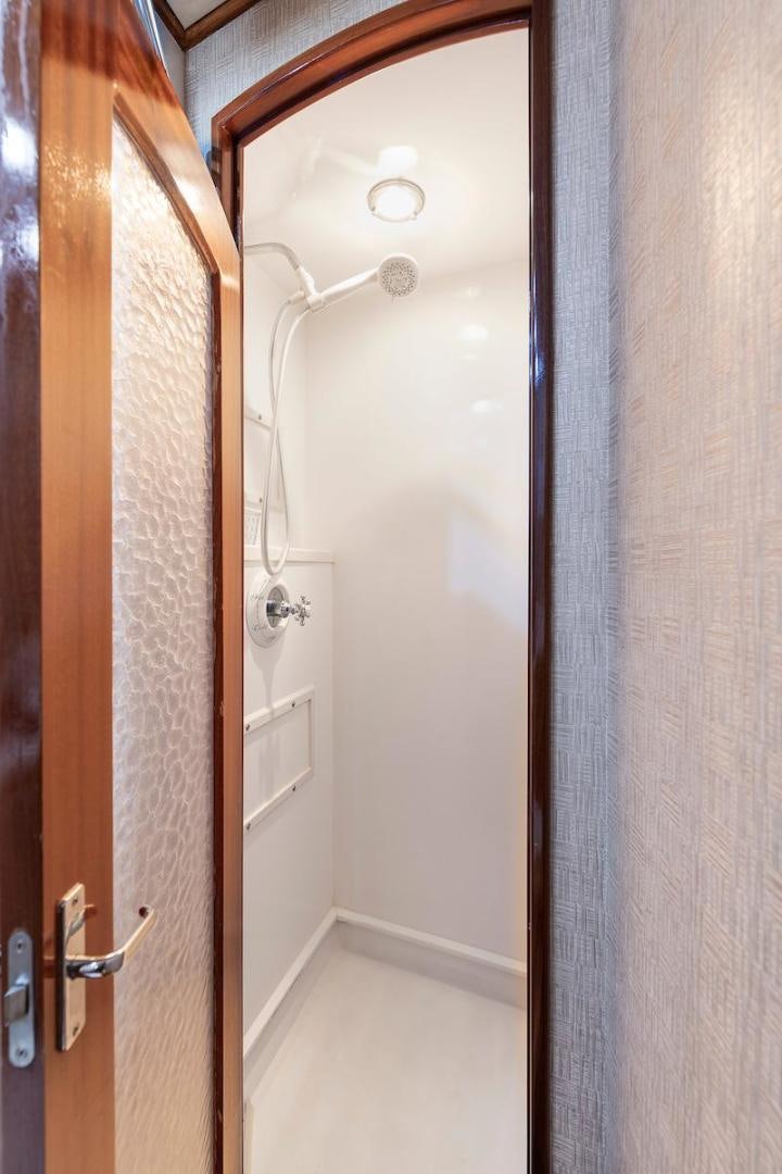 a door with a light on the door aboard ADVENTURER Yacht for Sale