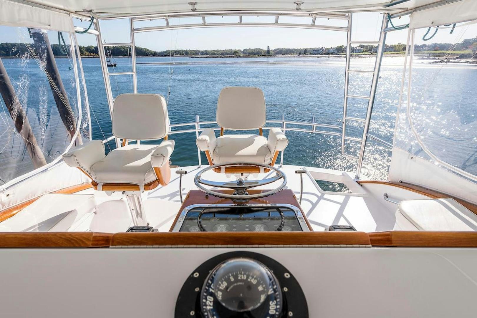 a boat with seats on the deck aboard ADVENTURER Yacht for Sale