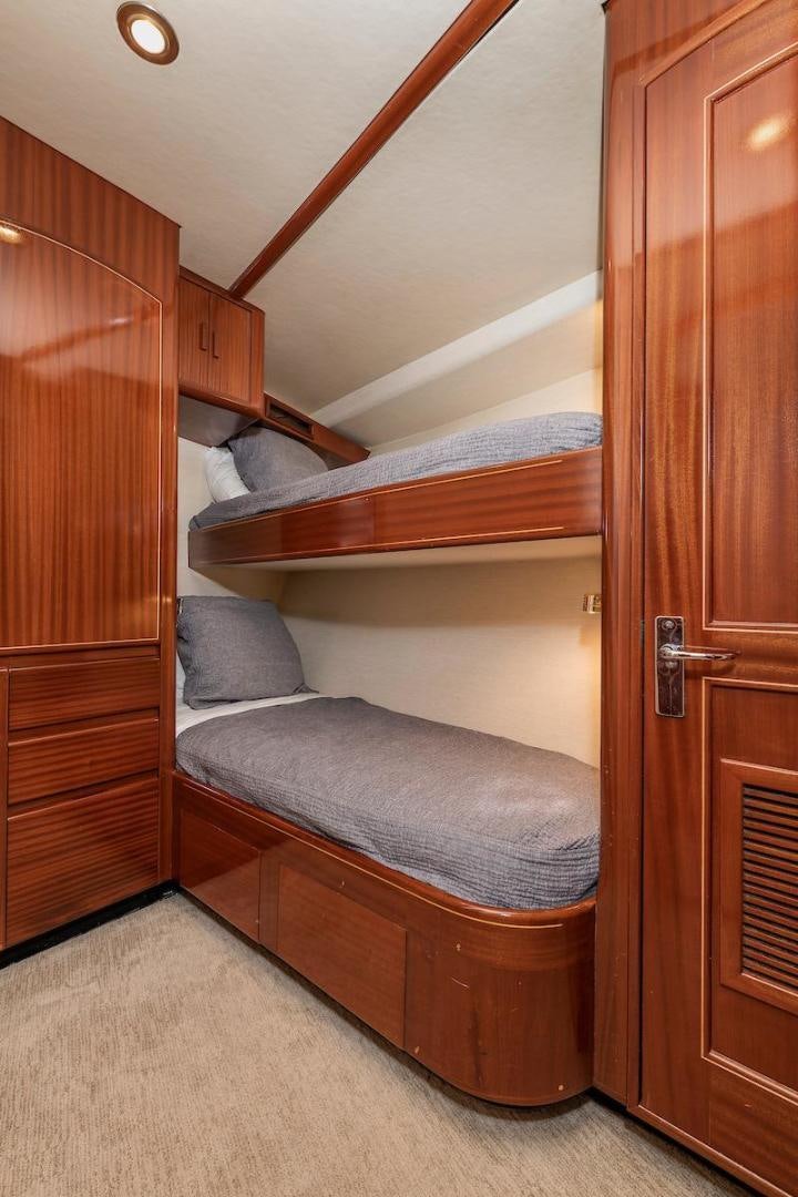 a bunk bed in a room aboard ADVENTURER Yacht for Sale