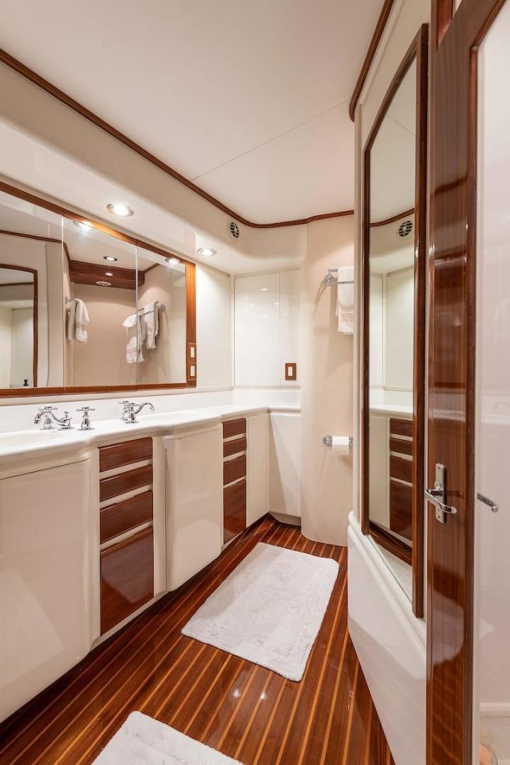 a bathroom with a large mirror aboard ADVENTURER Yacht for Sale