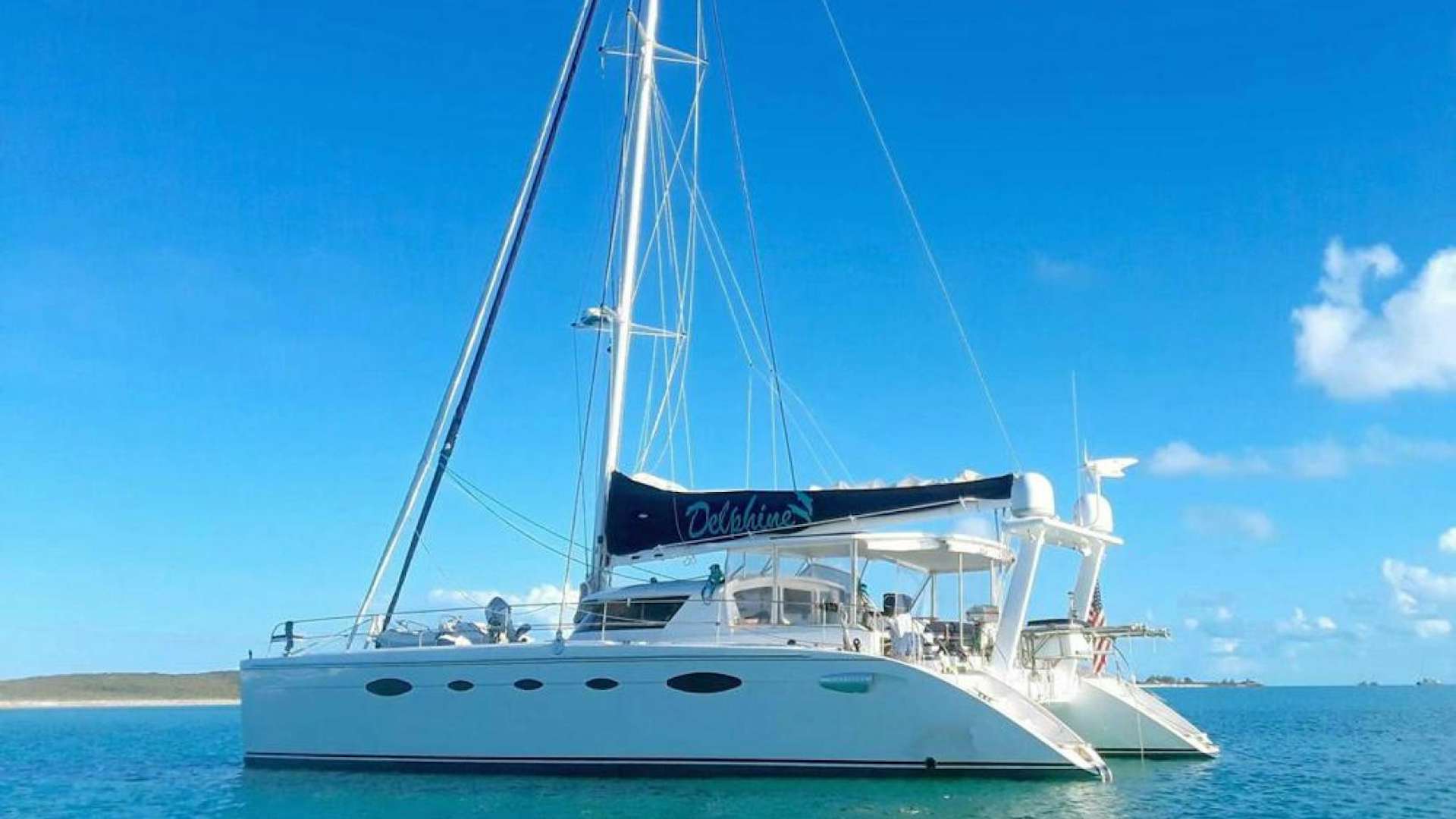 a white boat on the water aboard DELPHINE Yacht for Sale