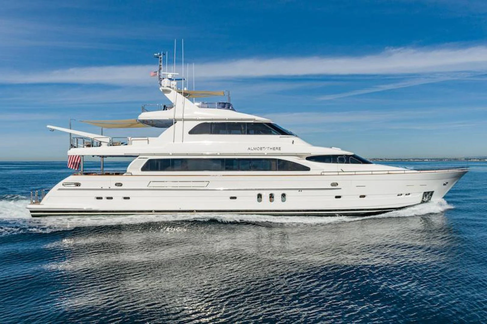 a white yacht on the water aboard ALMOST THERE Yacht for Sale