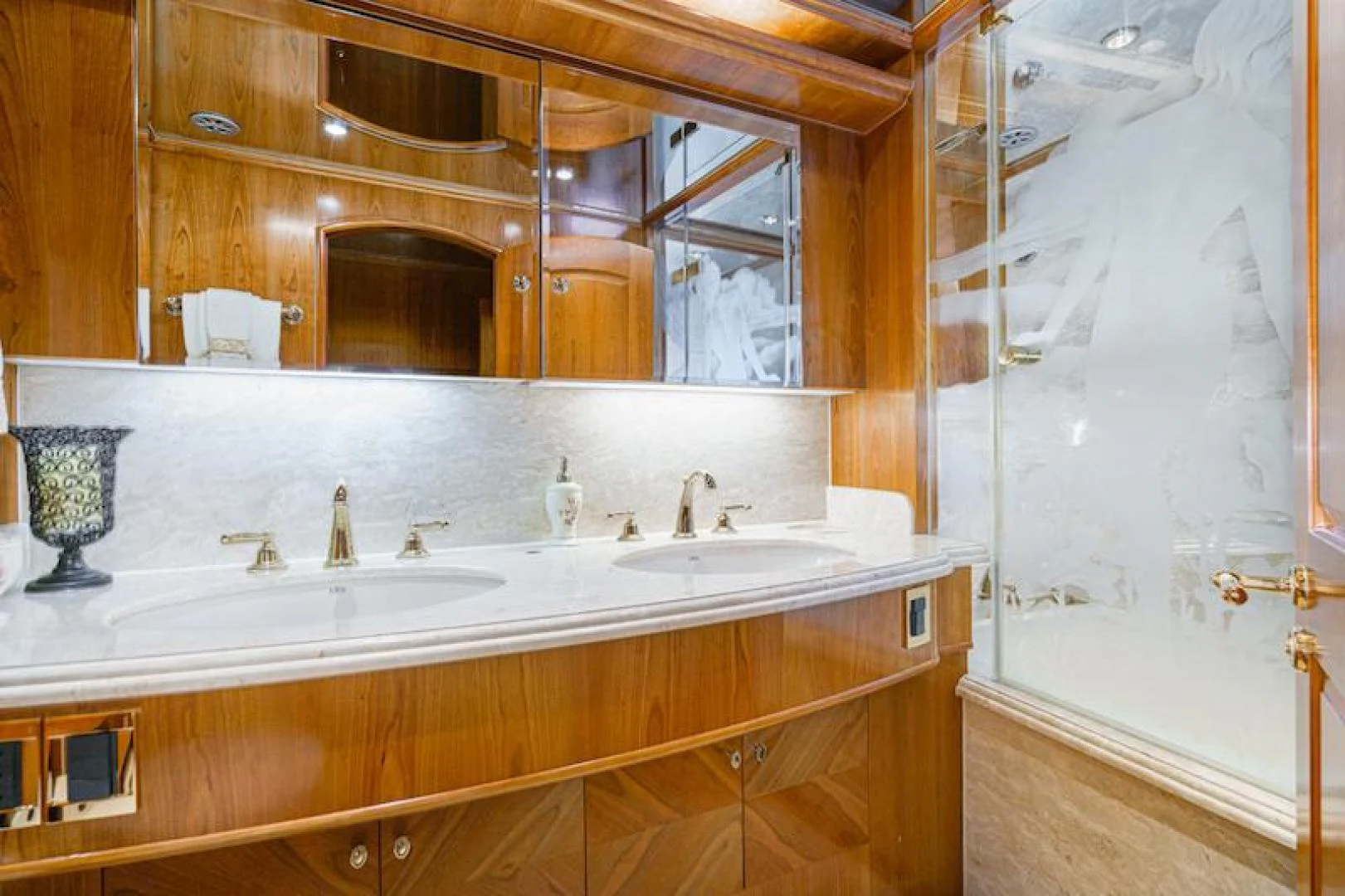a bathroom with a large mirror aboard ALMOST THERE Yacht for Sale