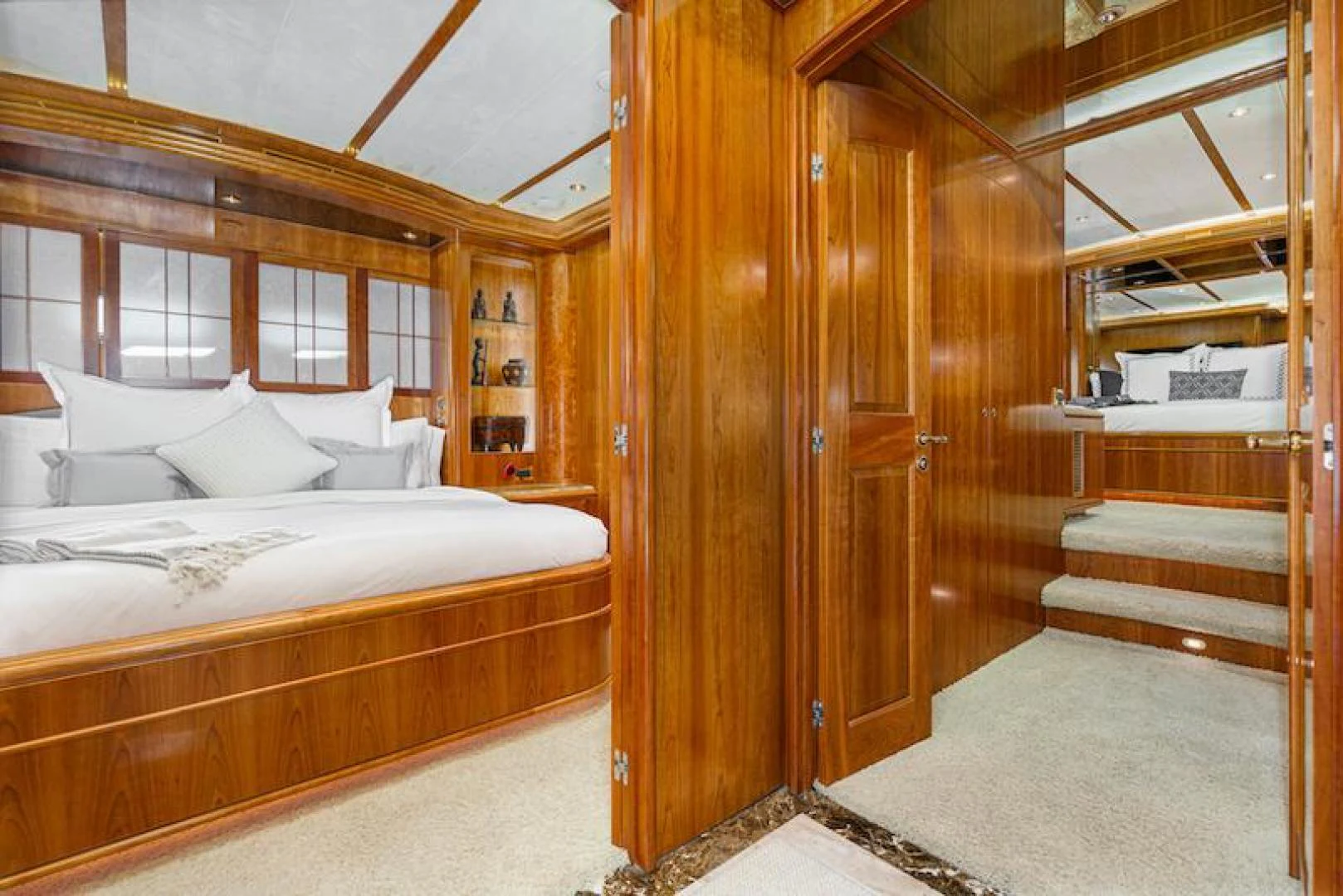 a bedroom with a bed and a closet aboard ALMOST THERE Yacht for Sale