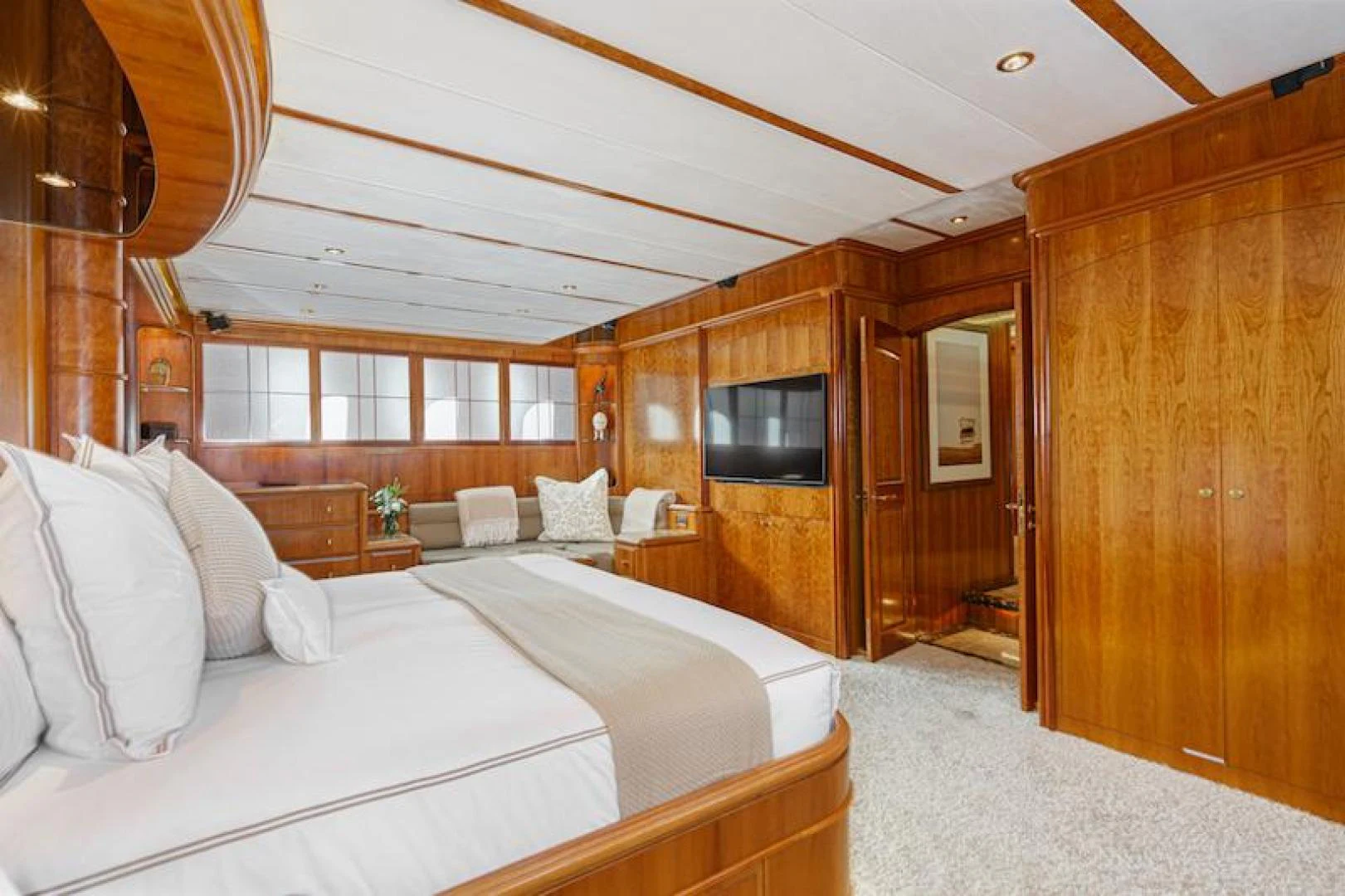 a room with a bed and a television aboard ALMOST THERE Yacht for Sale