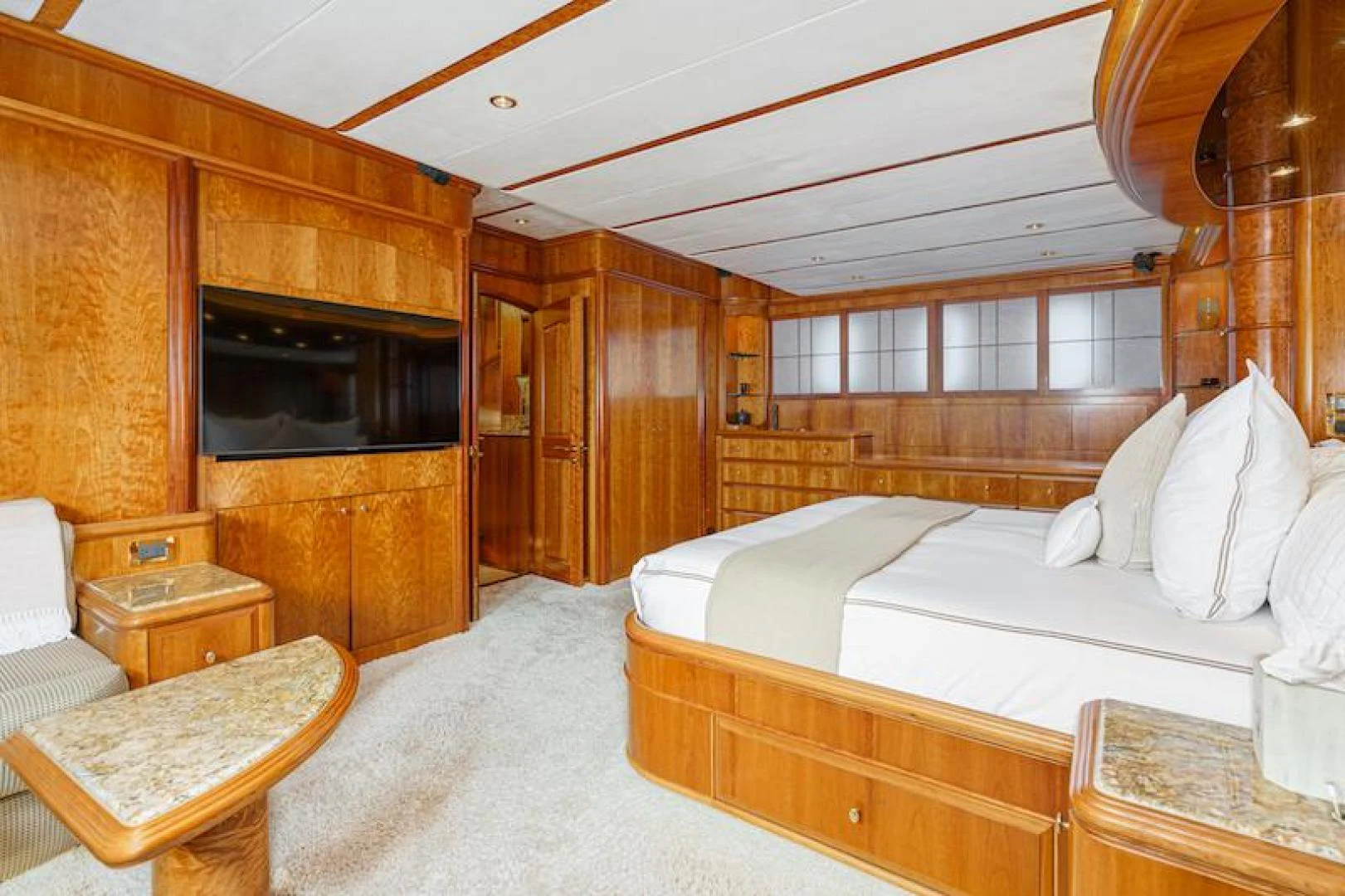 a bedroom with a bed and a television aboard ALMOST THERE Yacht for Sale