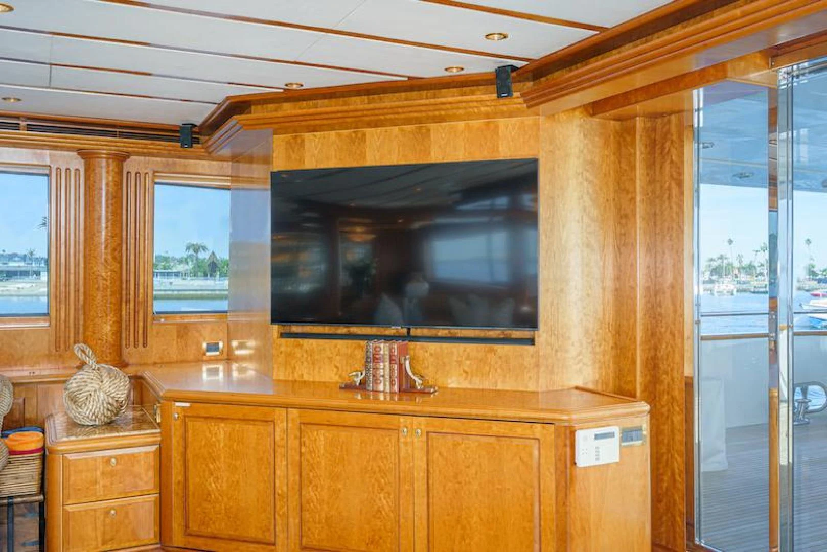 a room with a tv and cabinets aboard ALMOST THERE Yacht for Sale