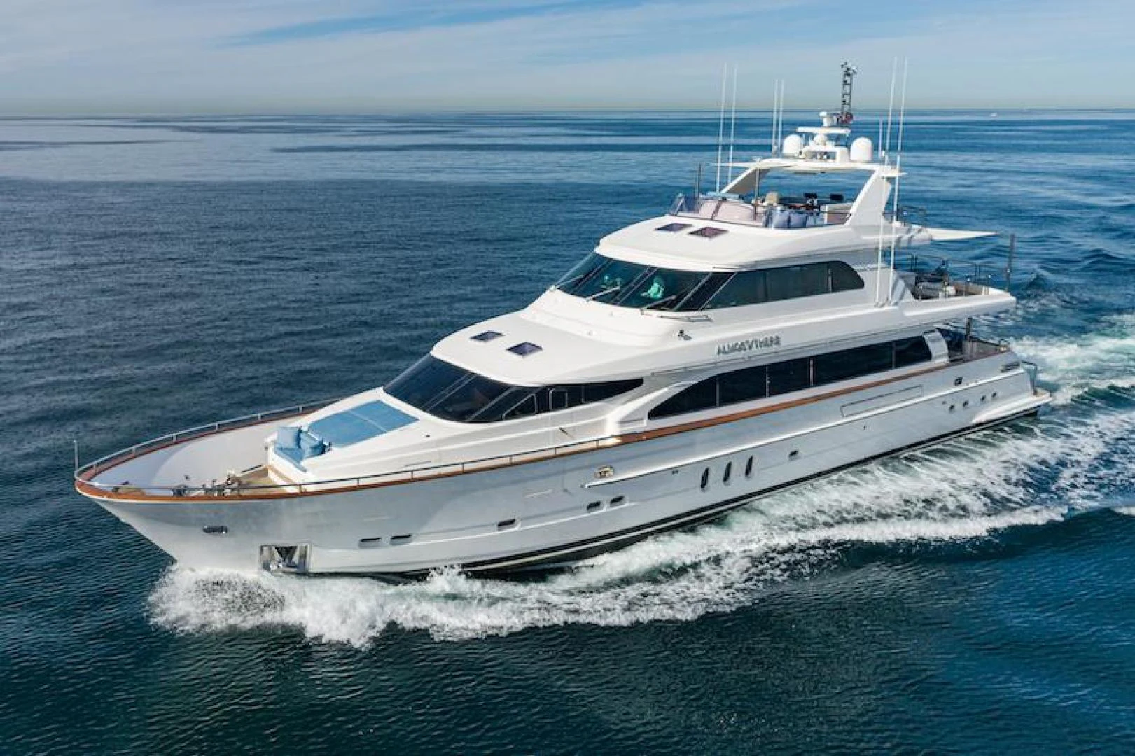 a white yacht in the water aboard ALMOST THERE Yacht for Sale