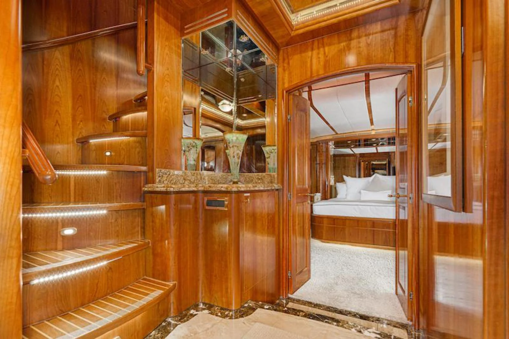 a room with a bed and a mirror aboard ALMOST THERE Yacht for Sale