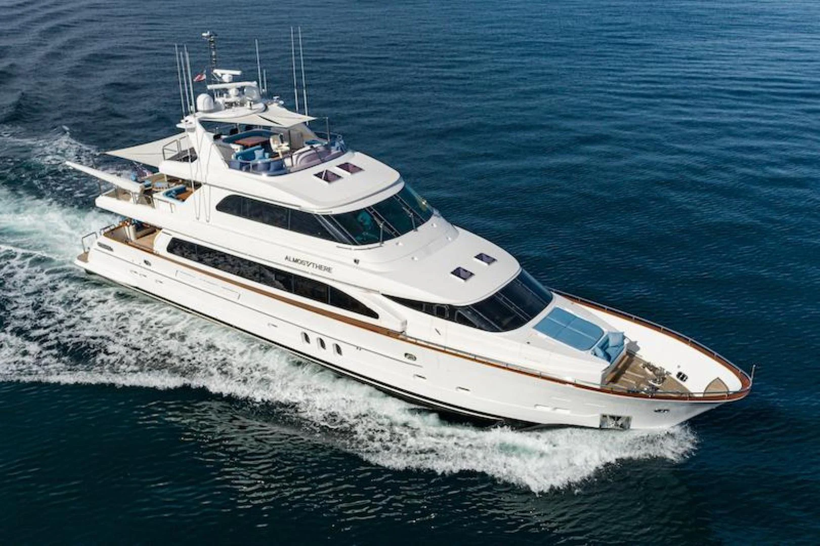 a white yacht on the water aboard ALMOST THERE Yacht for Sale