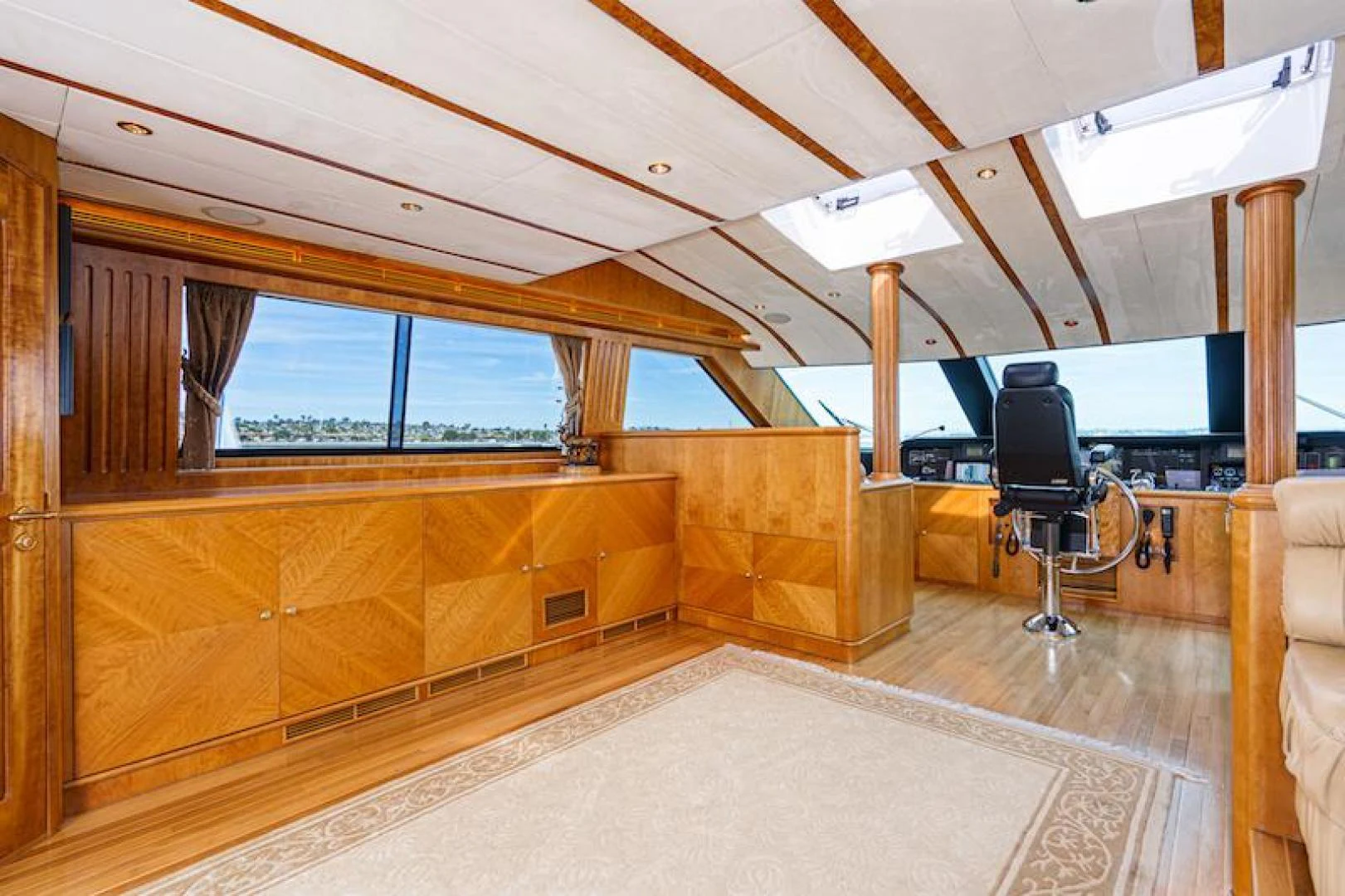 a room with a tv and a couch aboard ALMOST THERE Yacht for Sale