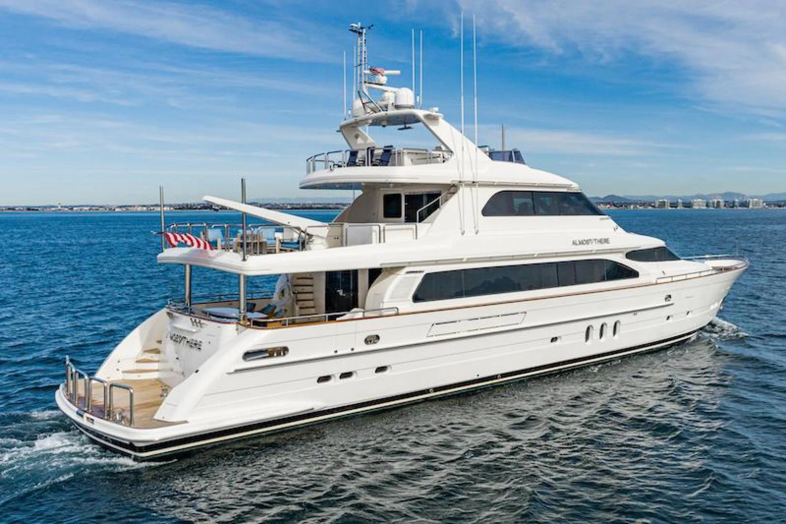 a white yacht on the water aboard ALMOST THERE Yacht for Sale